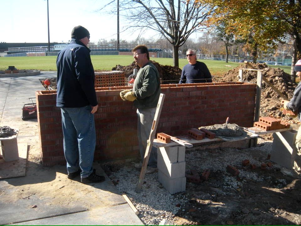 Community volunteers building the Armory Park war memorial